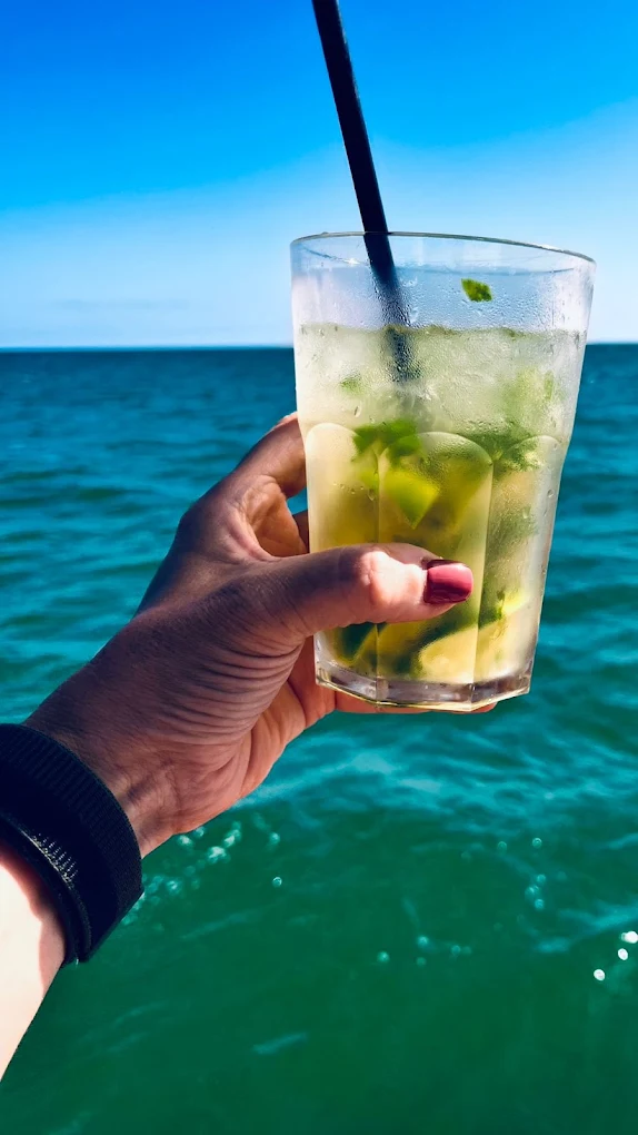 Mojito with the turquoise Mediterranean sea of Castelldefels in the background